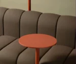 Close-up of Bla Station BOB Café modular sofa in studio setting with integrated side table and hanger.