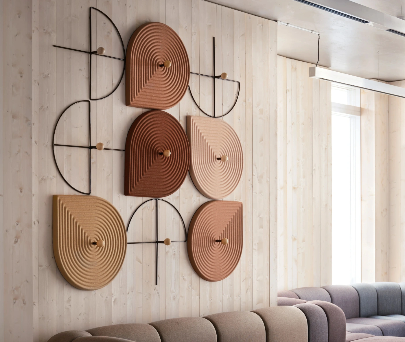 Close-up of Bla Station Decofunc acoustic wall panel mounted on a wall in a lounge setting.