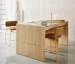 Bla Station Dundra Barchairs in a studio setting with upholstered seats and backrests on slender metal sled bases.