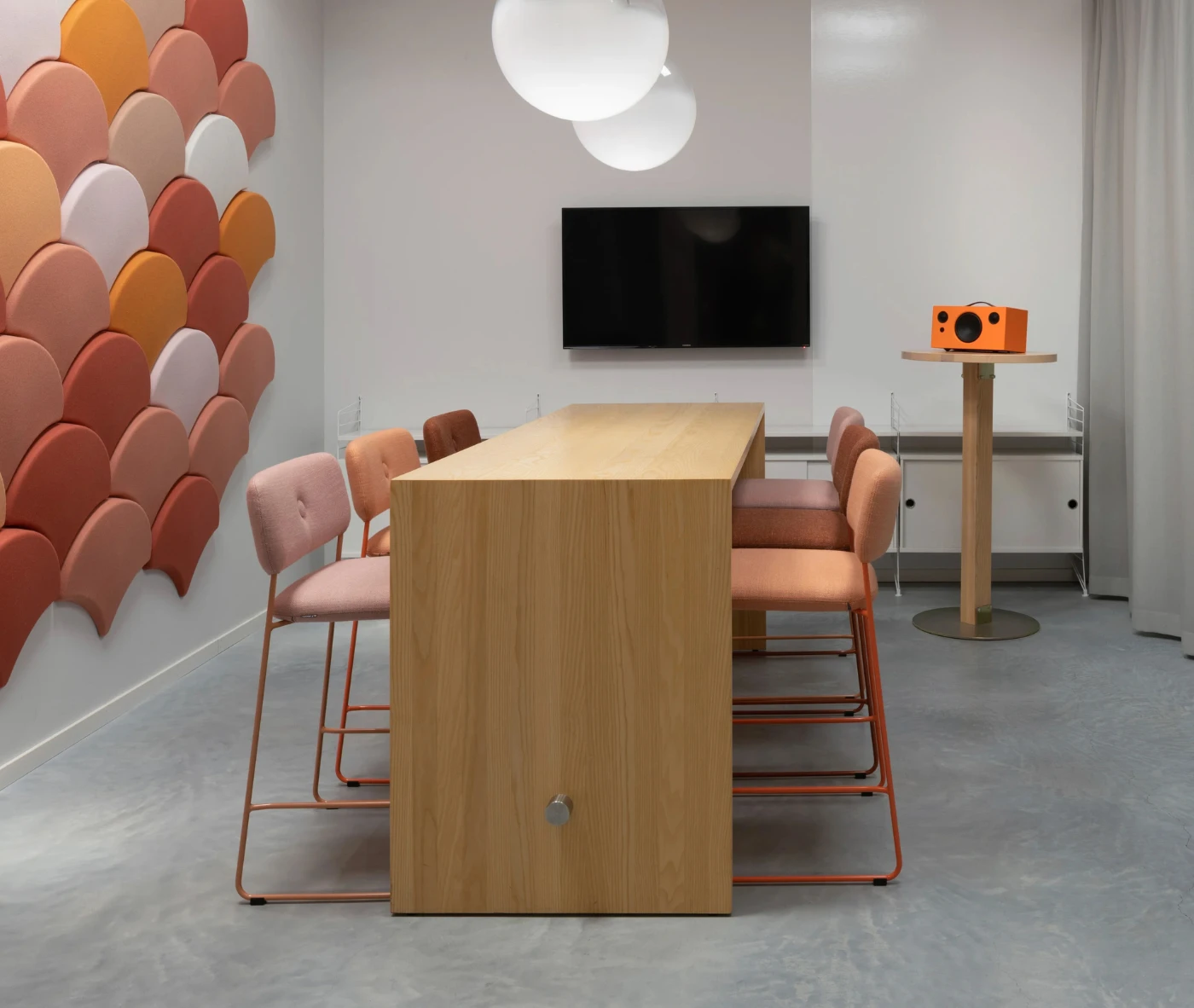 Bla Station Dundra Barchairs in a workplace setting with upholstered seats and backrests on slender metal sled bases.