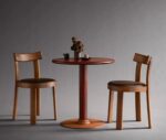 Bla Station Frankfurter table and chairs featuring dark brown timber finishes in a studio setting.