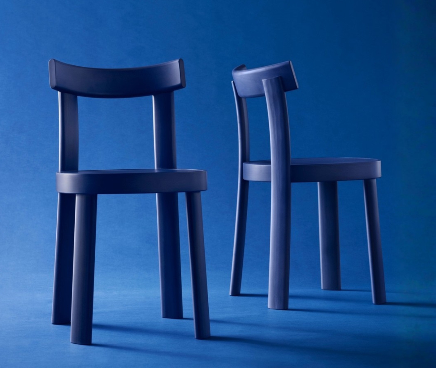 Bla Station Frankfurter chairs in studio setting with timber material in blue finishes.
