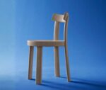 Bla Station Frankfurter chair in left-side view with a natural timber finish, shown in a studio setting.