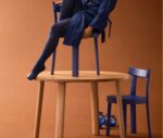Bla Station Frankfurter chair in blue finish displayed above a timber table.