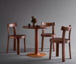 Bla Station Frankfurter table and chairs featuring dark brown timber finishes in a studio setting.