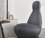 Bla Station Oppo lounge chair with a high rounded back and fully upholstered sculptural design.