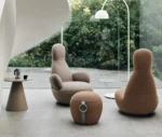 Bla Station Oppo lounge chairs with matching ottoman and Jackless side table in a modern lounge setting.