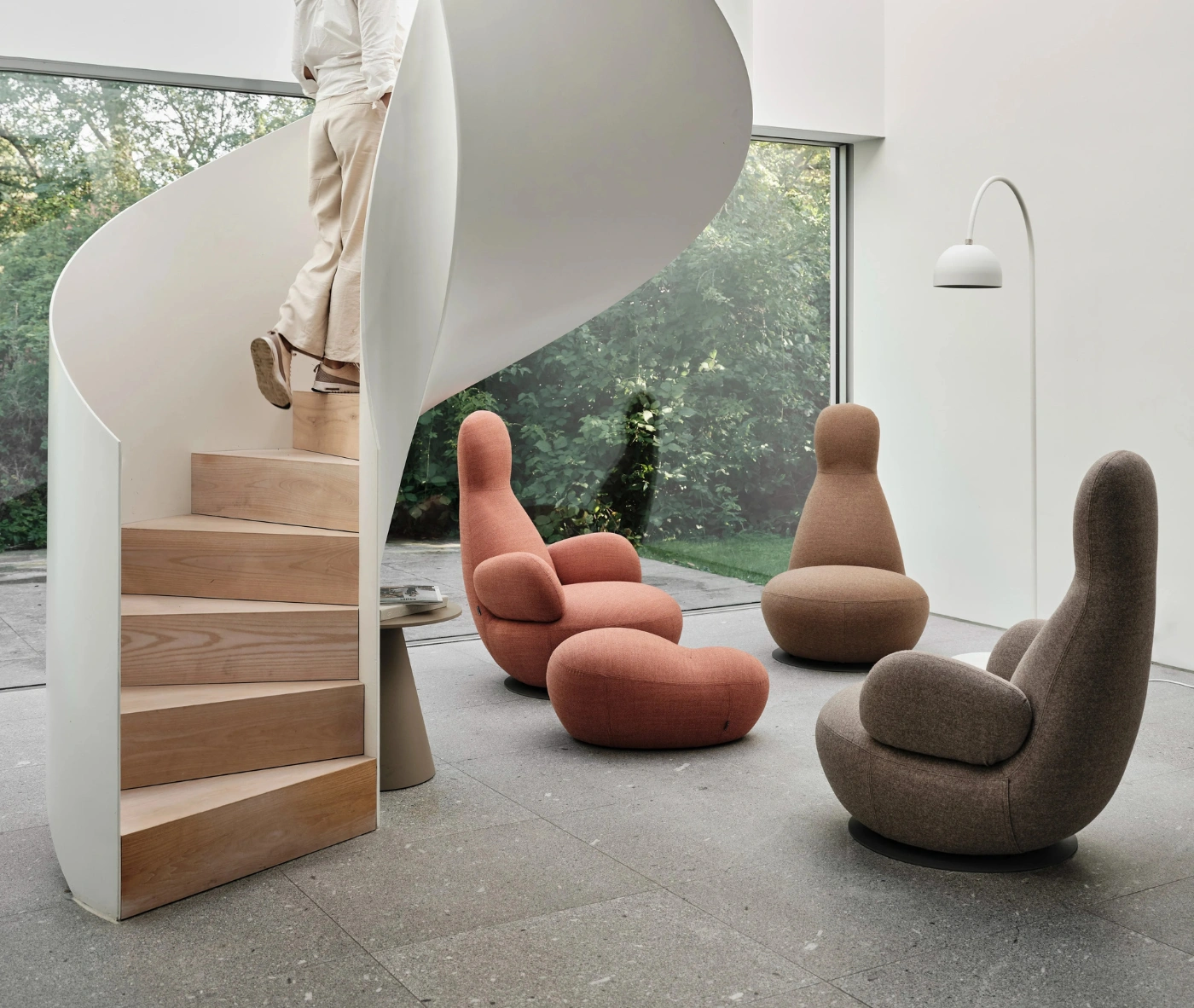Bla Station Oppo lounge chairs in assorted upholstery with matching ottoman and Jackless side table in a lounge setting.