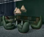 Bla Station BOB sofa and Oppo lounge chairs in dark green and Jackless side tables in a lounge setting.