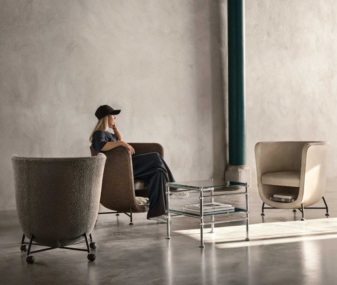 Bla Station Pocket lounge chairs in assorted upholstered design and under-seat storage in a lounge setting.
