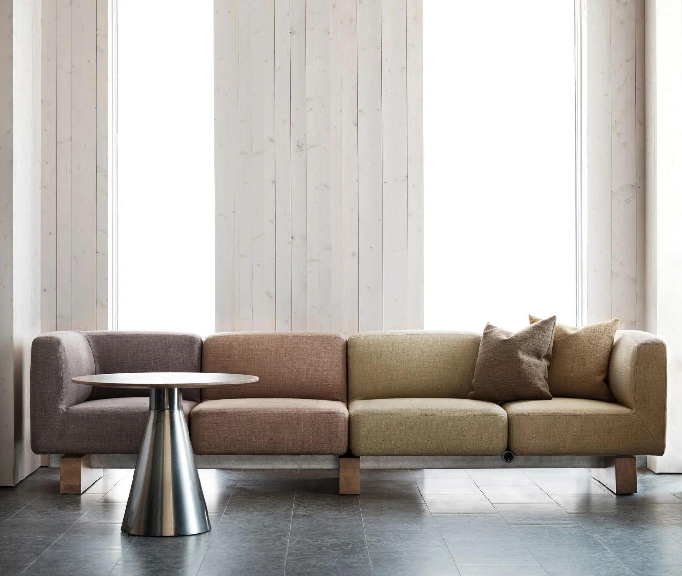 Bla Station Jackless table and RUT modular sofa in assorted upholstery in a lounge setting.