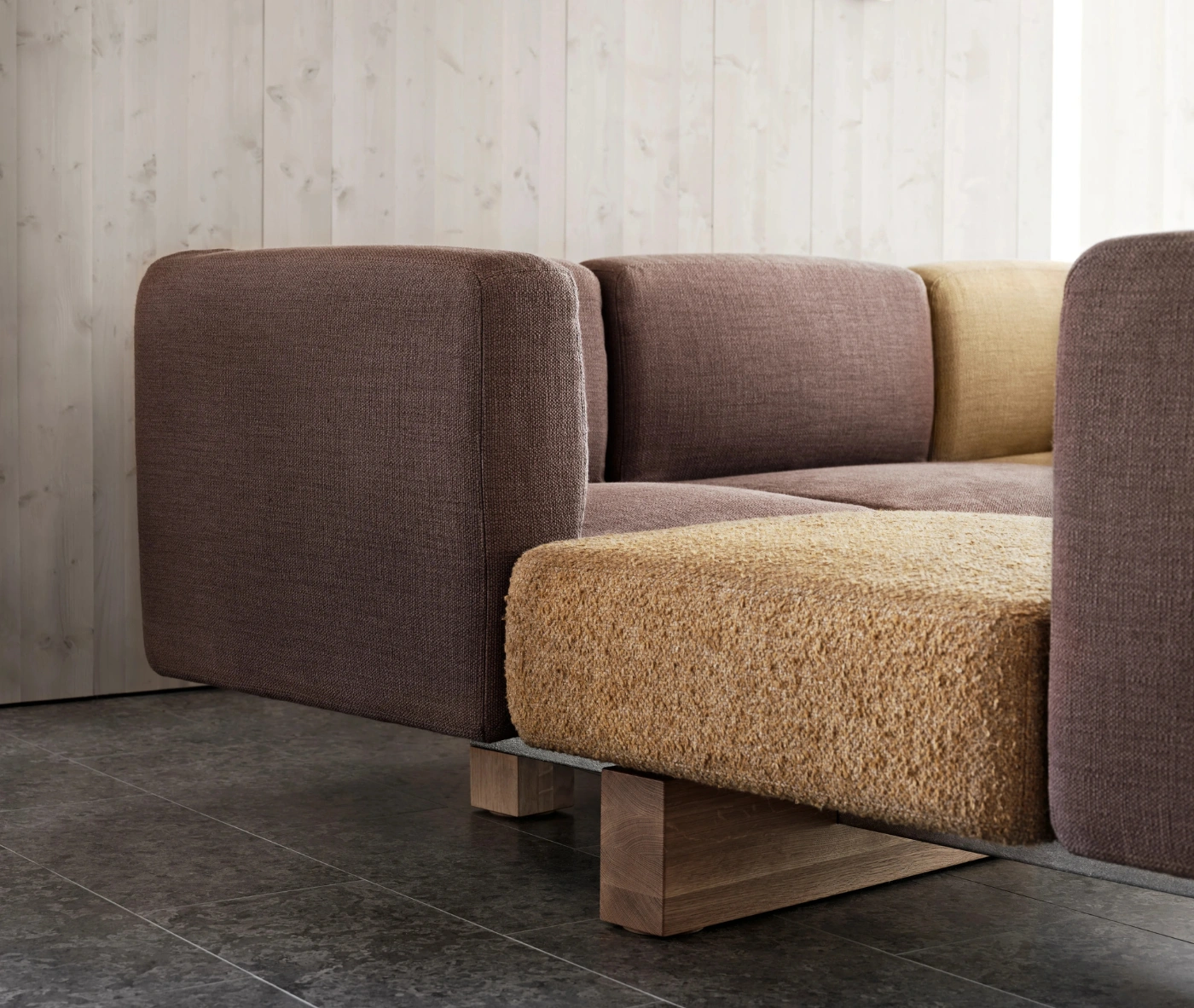 Close-up of Bla Station RUT modular sofa in assorted upholstery in a lounge setting.