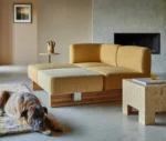 Bla Station RUT modular sofa in mustard yellow upholstery in a lounge setting.