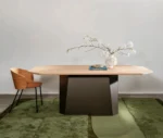 NEATT Petra occasional table front view of timber tabletop and sculptural pedestal base in a lounge setting.