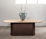 NEATT Petra occasional table front view of timber tabletop and sculptural pedestal base in a studio setting.