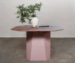 Neatt Petra front view of meeting table with timber tabletop, sculptural pedestal base, decorative vase, and books in studio setting.