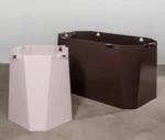 Neatt Petra angled view of disassembled sculptural pedestal base components in powder-coated steel.