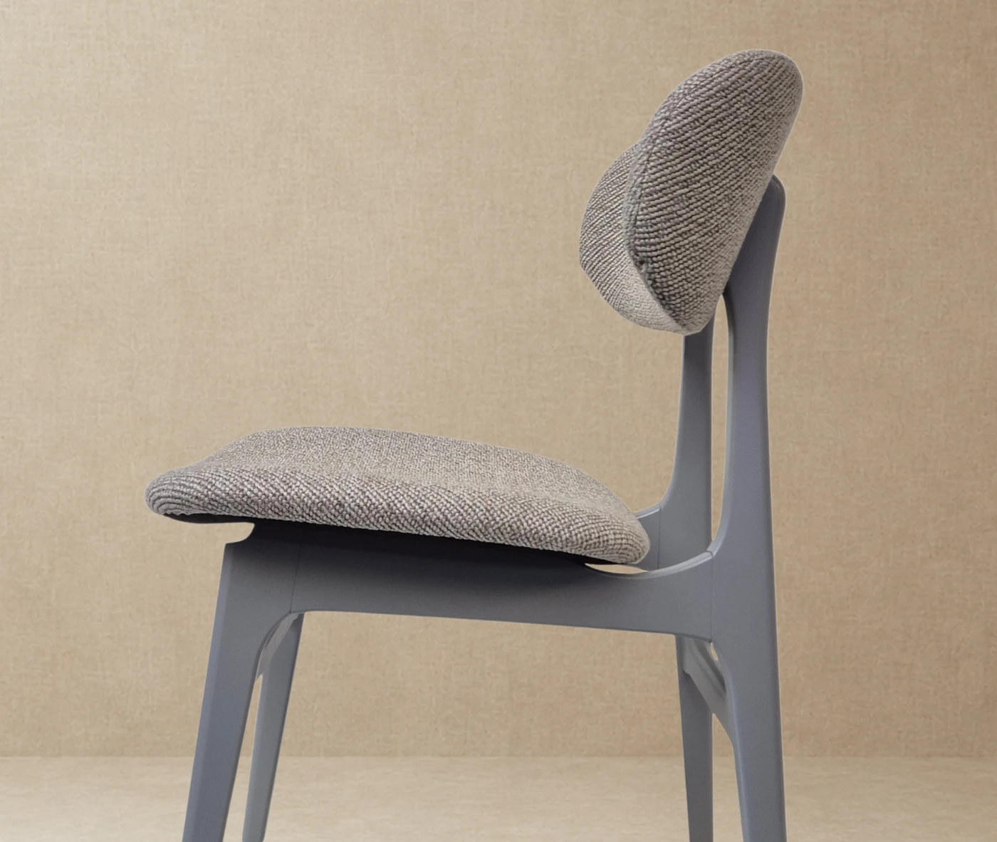 P4 Annalisa C2 hospitality chair in left-side, in studio setting, grey upholstered seat, and timber frame.