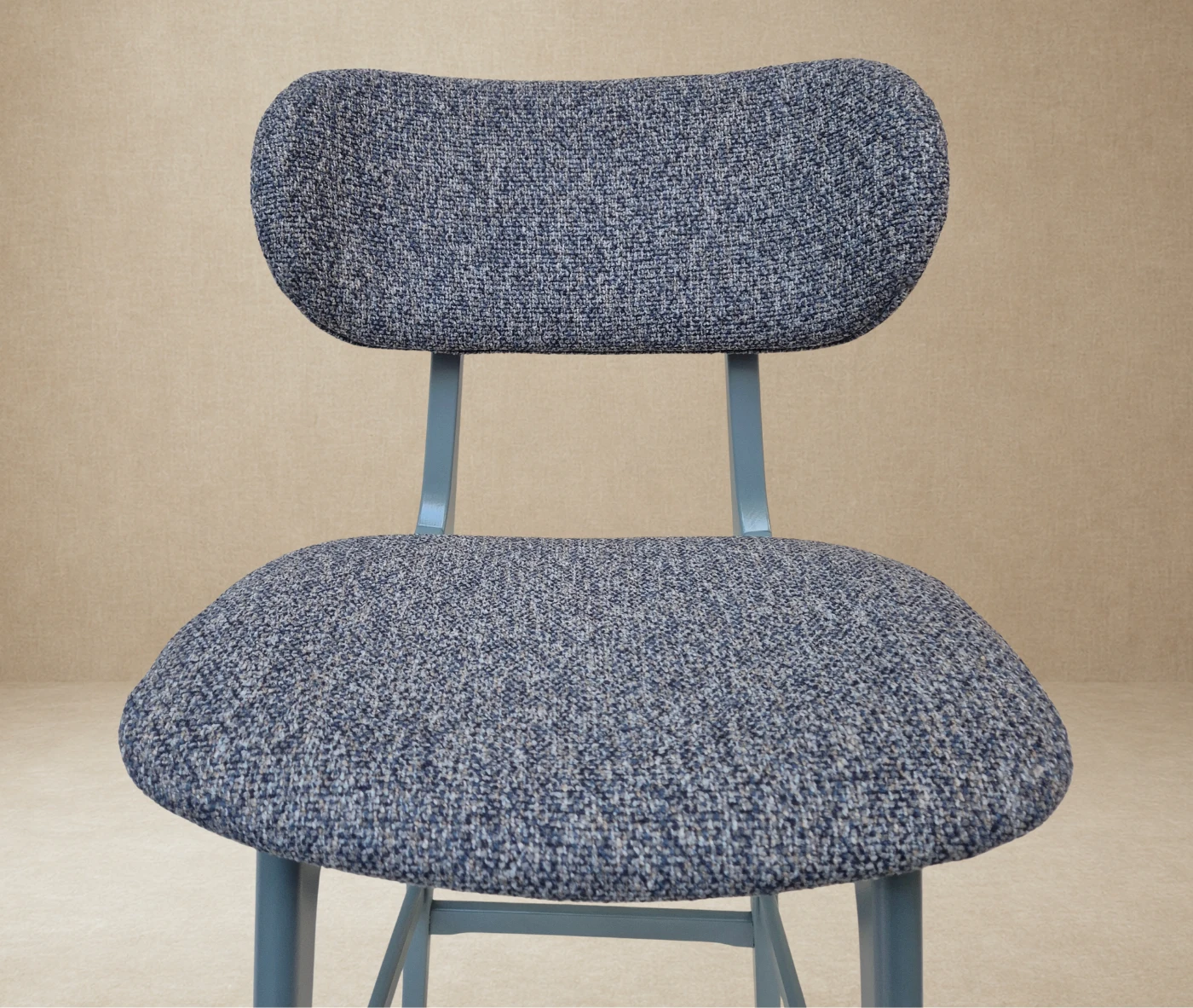 Close-up of P4 Annalisa S2 stool in studio setting, dark upholstered seat and backrest in timber frame.