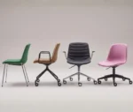 P4 Yoga chairs in various colours and base styles, displayed in a studio setting.