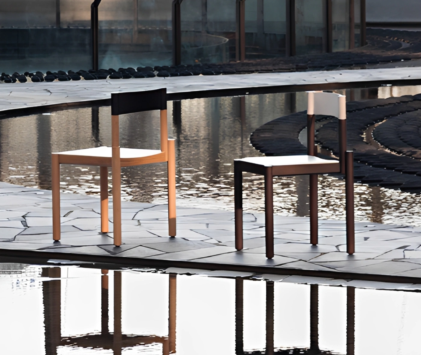 True Adinne chairs in outdoor setting with timber finishes and leather backrests.