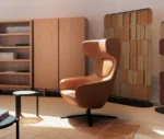 True Ahkka lounge chairs in lounge setting with sculpted upholstery and swivel bases.