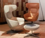 True Ahkka lounge chairs and ottoman in lounge setting with sculpted upholstery and swivel bases.