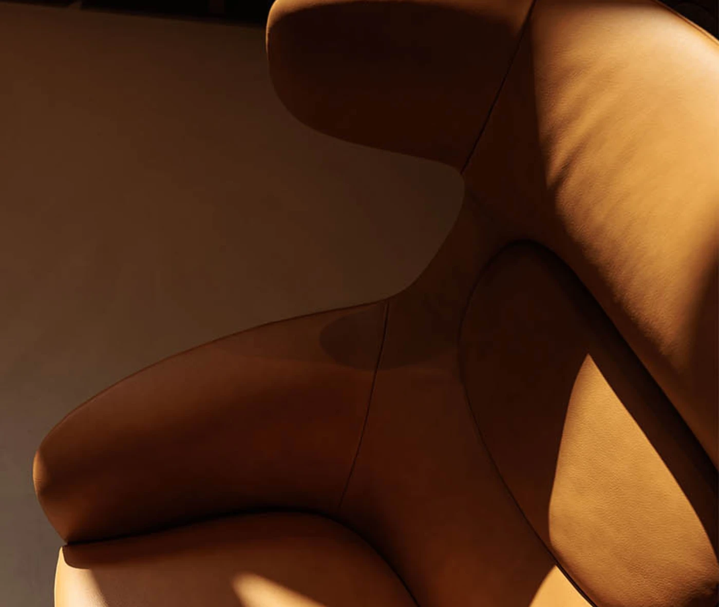 Close-up of the True Ahkka lounge chair upholstered form and integrated headrest.