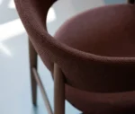 Detail of True Aura in meeting setting with upholstered backrest and seat.