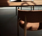 Detail view of True Aura in meeting setting with upholstered backrest and seat.