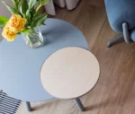True Cloud occasional table shown from above with blue and timber round tops in a styled lounge setting.