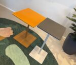 True Cremino tables in showroom setting with rectangular top and slim pedestal base.