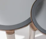 True Cute occasional tables, close-up view with round glass tabletop and timber legs.