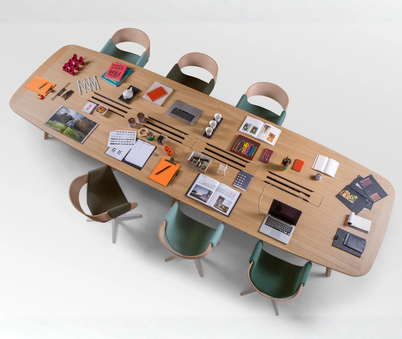True Wing Working table in top view, studio setting with timber tabletop, styled as a shared workspace with accessories on top.
