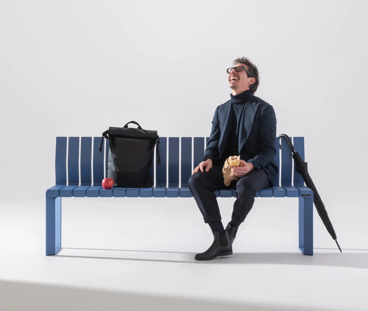 Urbantime Liberty.080 outdoor bench in a studio setting with seated lifestyle scene.