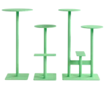 Bla Station Combo tables and stools lined up in light green finishes with round tops.