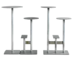 Bla Station Combo tables and stools in front view in light grey finishes with round tops and multi-level metal bases.
