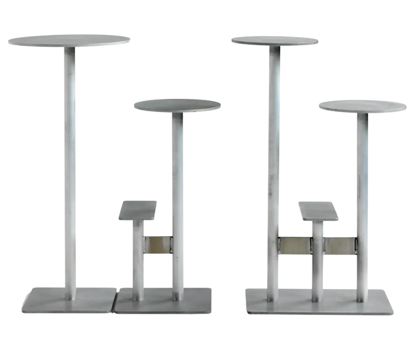 Bla Station Combo tables and stools in front view in light grey finishes with round tops and multi-level metal bases.