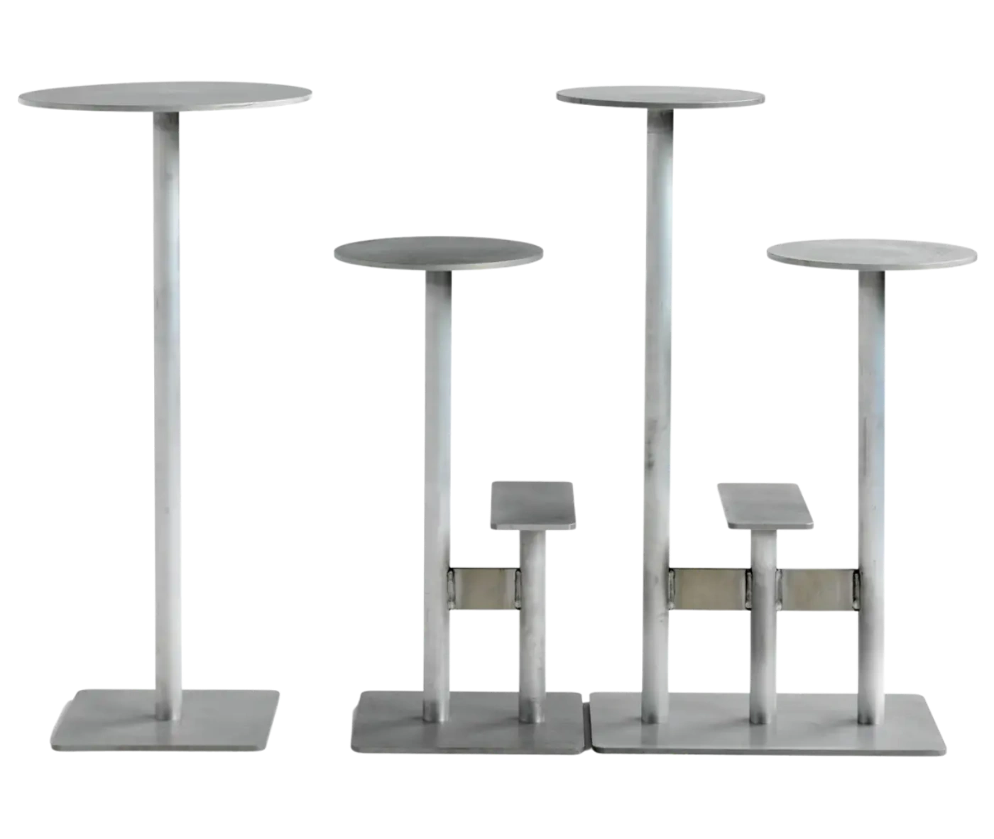 Bla Station Combo tables and stools lined up in varied heights with round tops and sculptural metal bases in light grey finish.