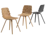 Bla Station Dent Wood chairs with sculpted timber seat shells and angled timber legs.