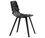 Bla Station Dent Wood B504 chair in side view with sculpted upholstered seat and timber legs in black finish.