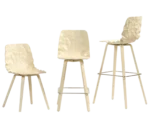 Bla Station Dent Wood chair and stools with sculpted timber seat shells, timber legs, and metal footrests.