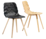 Bla Station Dent Wood chairs with sculpted seat shells and timber legs in light and dark finishes.