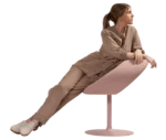 Person reclining on a Bla Station Innovation C-shaped chair that combines seating and a tabletop surface.
