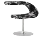 Bla Station Innovation C-shaped chair in front-right view, combining seating and a tabletop with abstract upholstery.