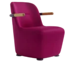 Bla Station Jackson lounge chair in pink upholstery with curved backrest and timber armrests.