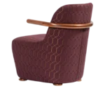 Bla Station Jackson lounge chair in left-side view, upholstered in patterned fabric with a curved backrest and armrests.