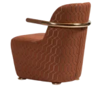 Bla Station Jackson lounge chair in left-side view, upholstered in patterned fabric with a curved backrest and armrests.