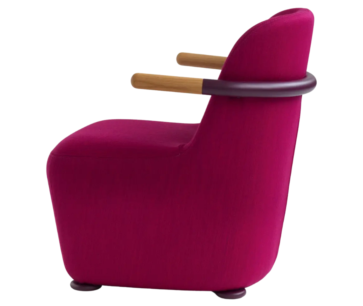 Bla Station Jackson lounge chair in left side view in pink upholstery with curved backrest and timber armrests.