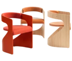 Bla Station Lucky lounge chairs in assorted finishes with curved timber frames and upholstered seats and backrests.